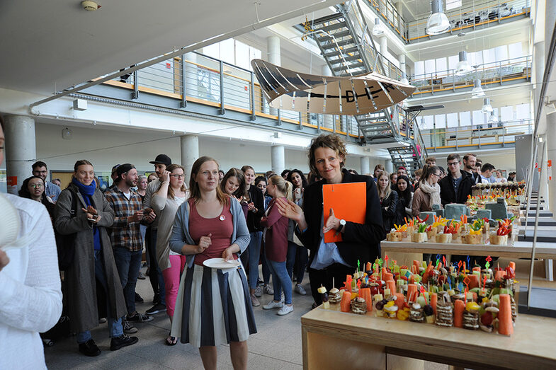 Visitors to the Open Day at the Faculty of Architecture stand at the buffet