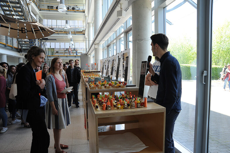 Visitors to the Open Day at the Faculty of Architecture stand at the buffet