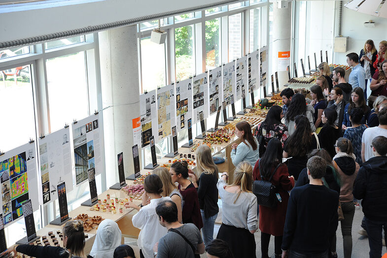 Visitors to the Open Day at the Faculty of Architecture stand at the buffet