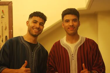 2 students in traditional dress