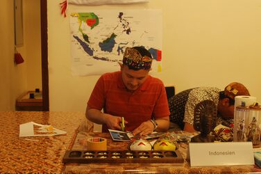 Cultural stand Indonesia: A student at a decorated table