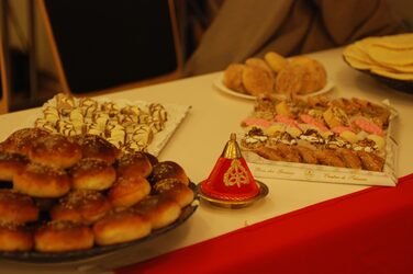 Close-up of food on a decorated table at the Morocco cultural stand.