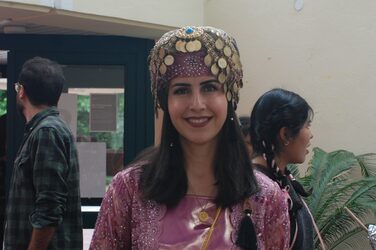 Kurdish cultural stand: student in traditional dress