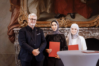 Students Sude Baysal and Palwascha Raschid at the award ceremony.