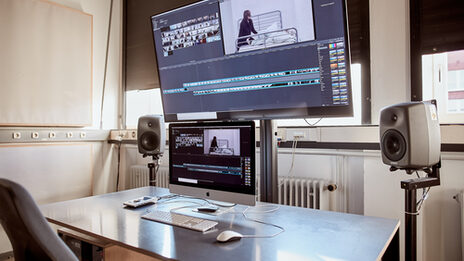 Photo of the computer workstation for editing videos. __ Computer workstation for editing videos.