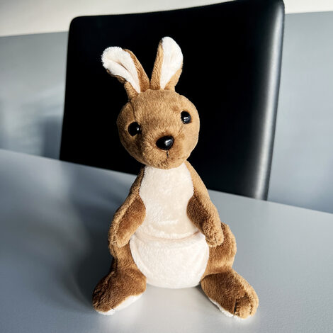 A soft toy in the shape of a kangaroo.