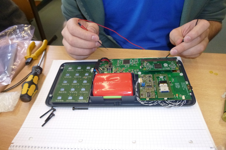 Photo of a student - in section - soldering.