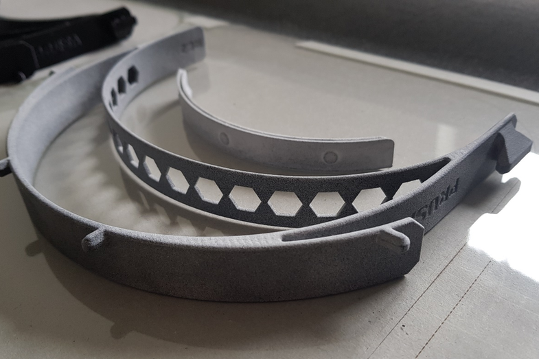 Photo of a 3D printed holder for Corona face shield.