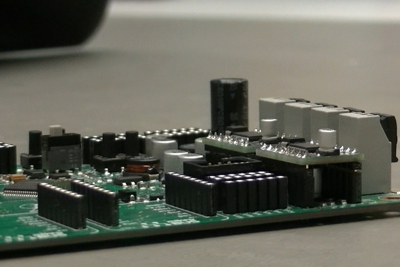 Photo of the "Dorobo" microcontroller board for robotics training.