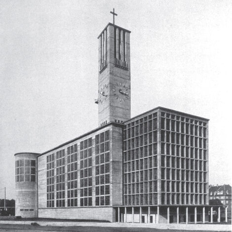 Black and white photo of a church building with lots of concrete and glass.