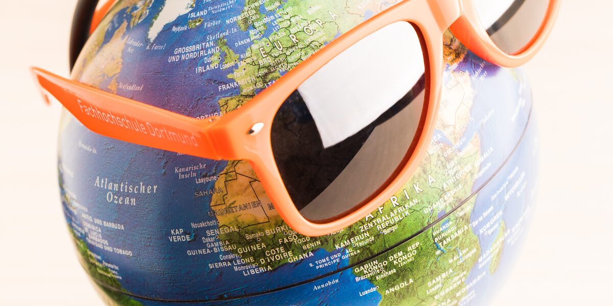 Photo of a globe wearing FH sunglasses.