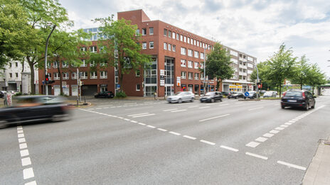 Photo of a building on Hohe Strasse in Dortmund, with the busy Hohe Strasse in front of it.