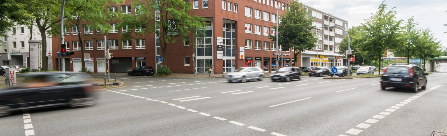 Photo of a building on Hohe Strasse in Dortmund, with the busy Hohe Strasse in front of it.