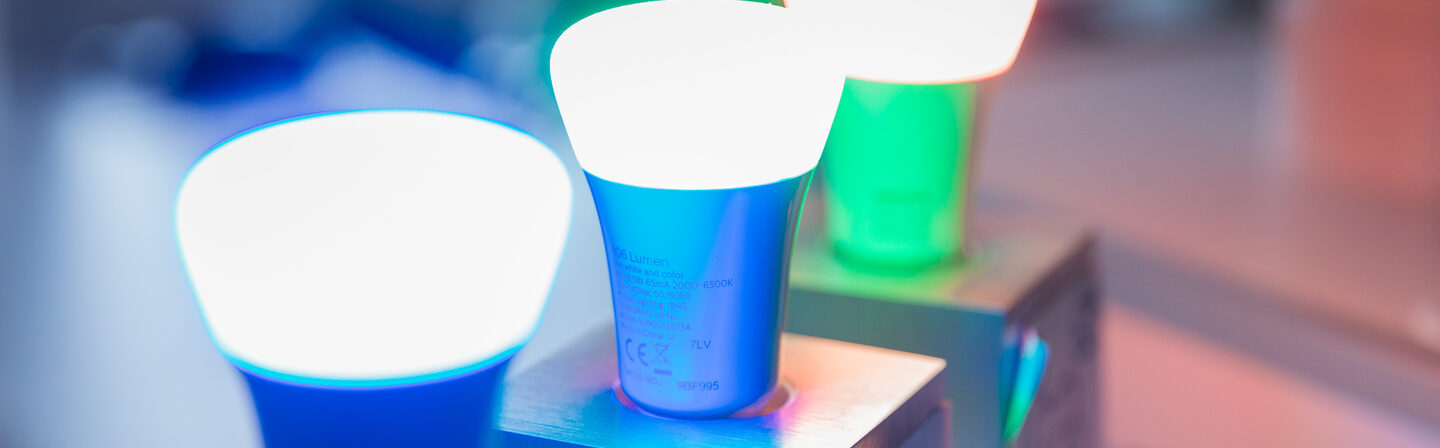 Photo of activated lamps from the Smart Living section, in blue, green and red.